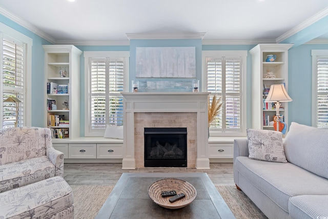 living room featuring crown molding and light wood-type flooring