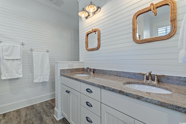 bathroom with hardwood / wood-style flooring and vanity