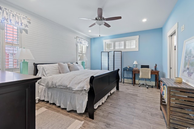 bedroom featuring light hardwood / wood-style floors and ceiling fan