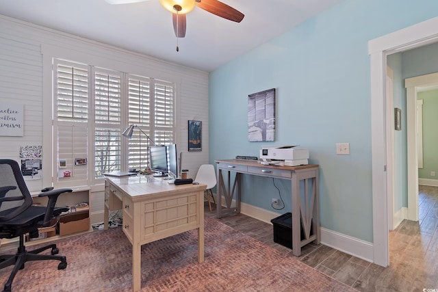 home office featuring hardwood / wood-style floors and ceiling fan