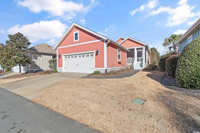 view of property featuring a garage and a sunroom