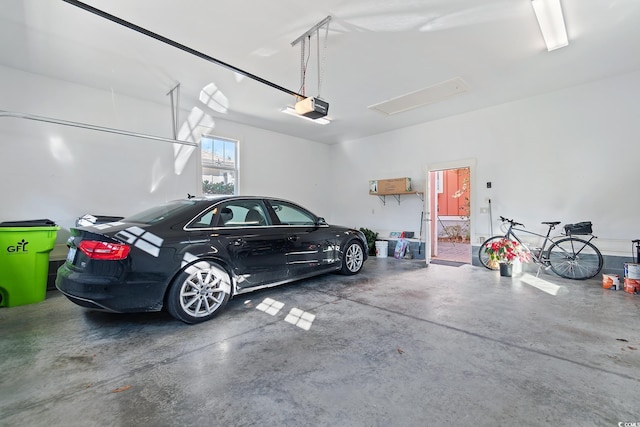 garage featuring a garage door opener