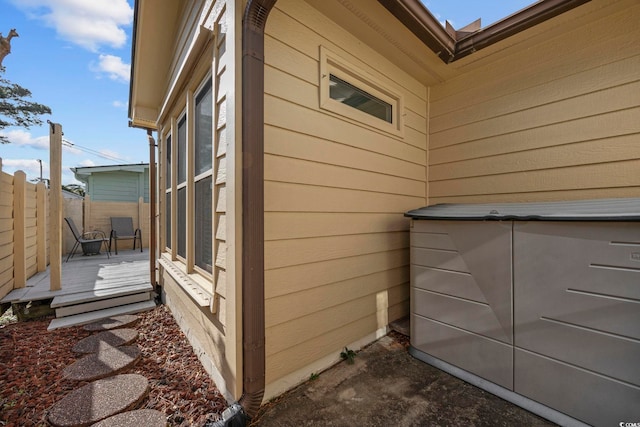 view of side of home featuring a wooden deck