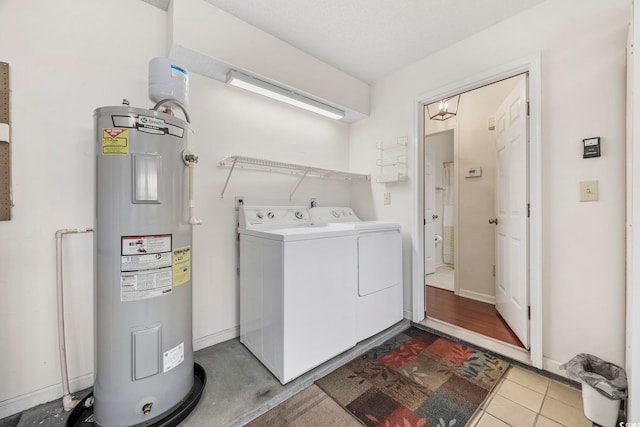 laundry room with independent washer and dryer and electric water heater