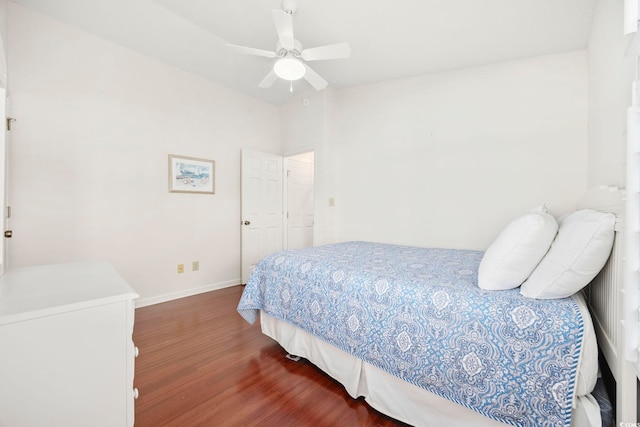 bedroom featuring lofted ceiling, hardwood / wood-style flooring, and ceiling fan