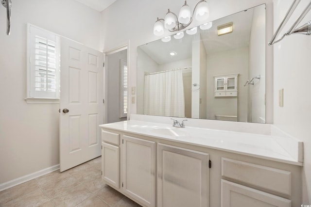 bathroom with vanity, tile patterned floors, toilet, and a shower with shower curtain