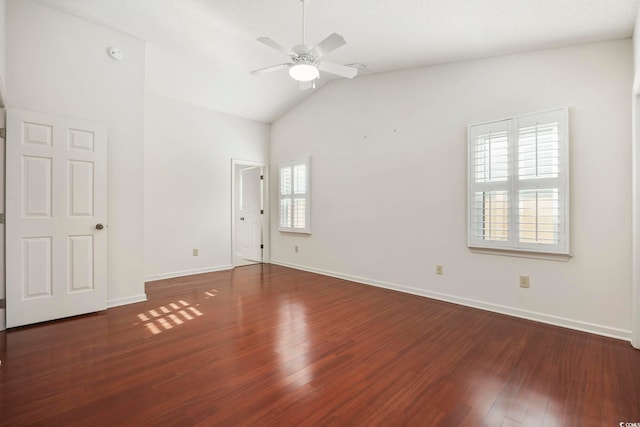 unfurnished room featuring vaulted ceiling, dark wood-type flooring, and ceiling fan