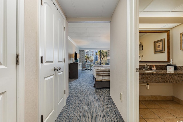 1105 S Ocean Blvd Unit 252, Myrtle Beach, SC 29577 - hallway featuring a sink, carpet floors, and tile patterned floors