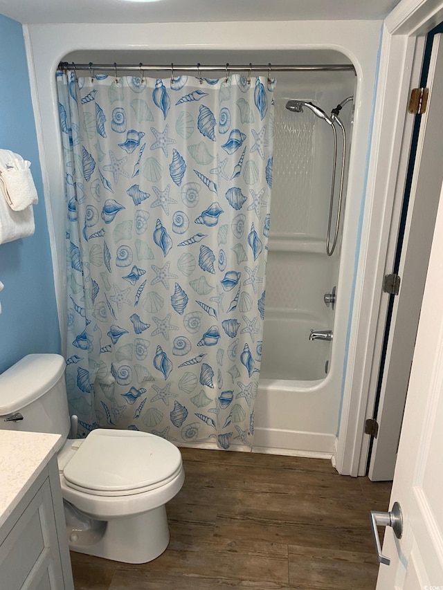 full bathroom with vanity, wood-type flooring, toilet, and shower / bath combo