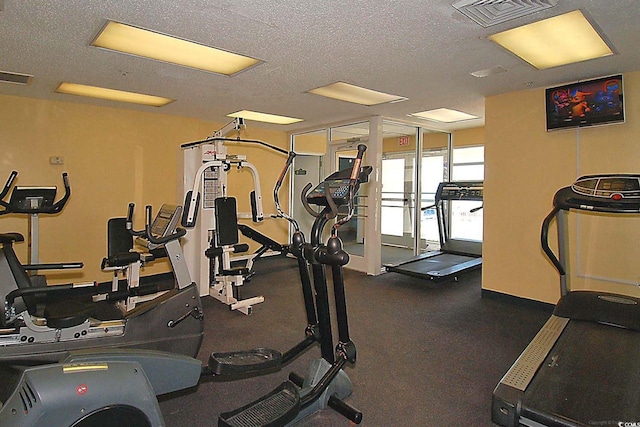 gym with a textured ceiling