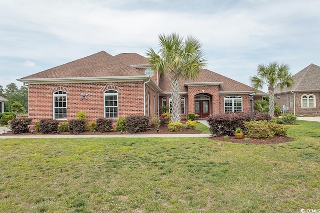 view of front facade featuring french doors and a front lawn