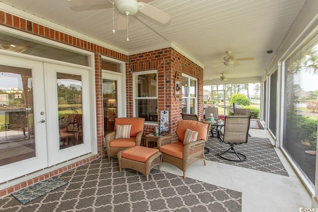 sunroom / solarium featuring ceiling fan