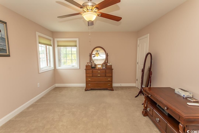 misc room with light colored carpet and ceiling fan