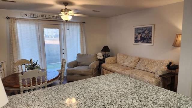 living room featuring ceiling fan