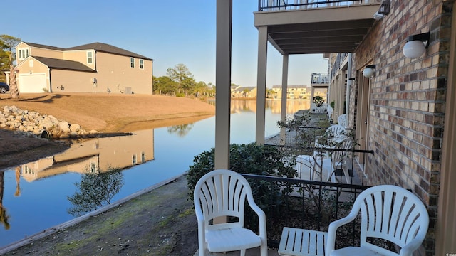 exterior space featuring a water view and a garage