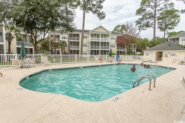 view of swimming pool with a patio area