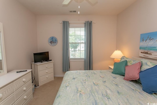 bedroom featuring ceiling fan and light colored carpet