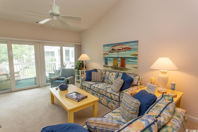 living room featuring ceiling fan, high vaulted ceiling, and light carpet