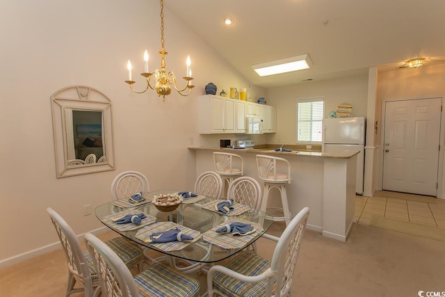 dining area with vaulted ceiling, light colored carpet, and an inviting chandelier