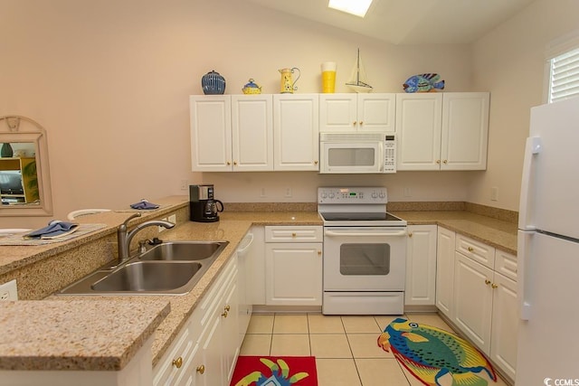 kitchen with sink, white cabinets, and white appliances