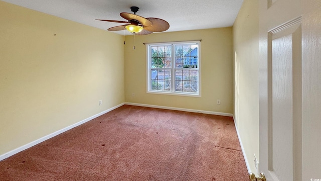 spare room featuring carpet flooring, a textured ceiling, and ceiling fan