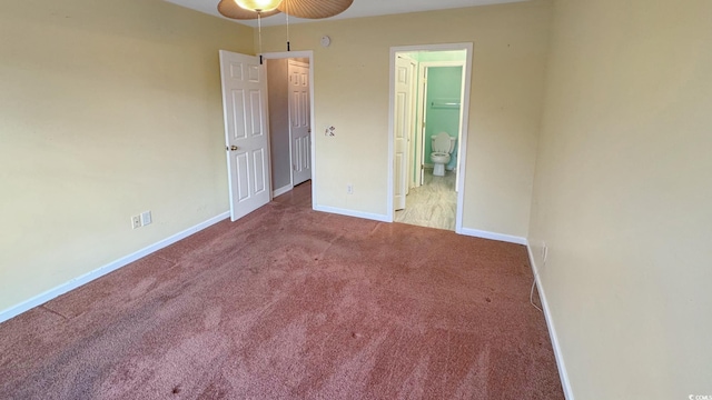 unfurnished bedroom with carpet and ensuite bath