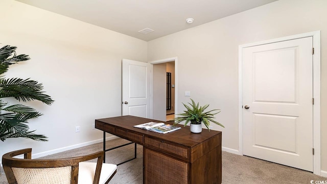 office area featuring light colored carpet