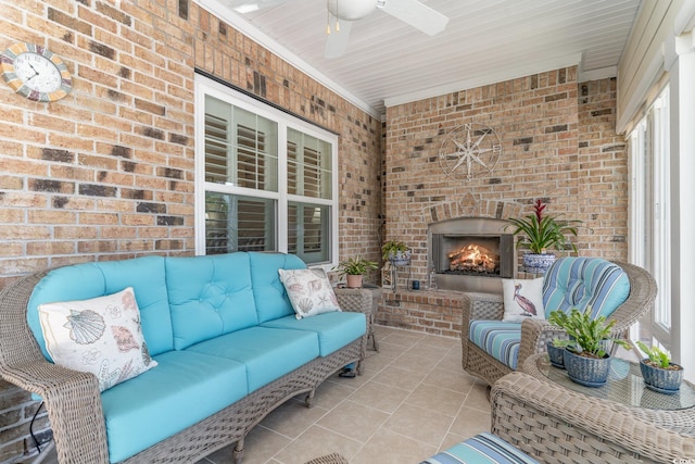 view of patio / terrace with an outdoor living space with a fireplace and ceiling fan