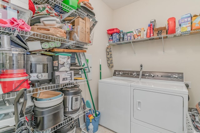 washroom with washer and dryer