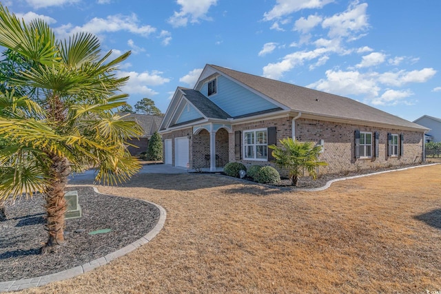 view of front facade with a garage and a front lawn