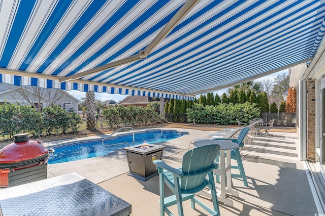 view of swimming pool featuring a fire pit, a patio area, and pool water feature