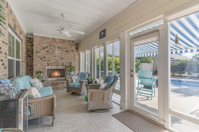 sunroom / solarium featuring ceiling fan