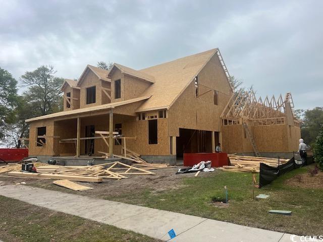 1004 James Island Ave, North Myrtle Beach, SC 29582 - view of front facade featuring a front lawn