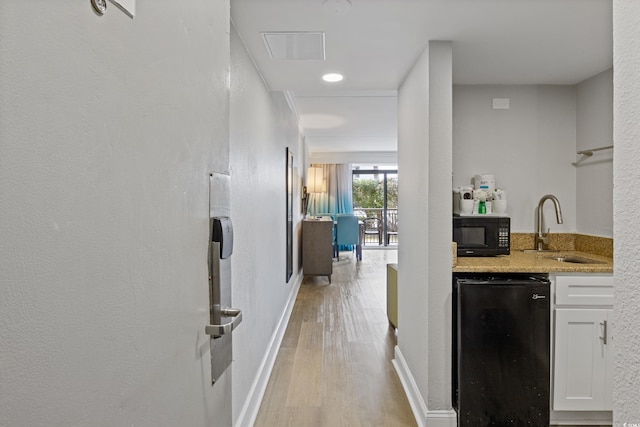 7200 N Ocean Blvd Unit 138, Myrtle Beach, SC 29572 - hall featuring light wood finished floors, baseboards, and a sink