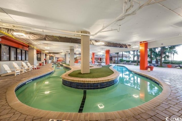 view of swimming pool featuring a patio area