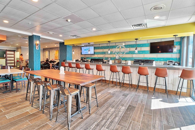 dining area featuring a drop ceiling