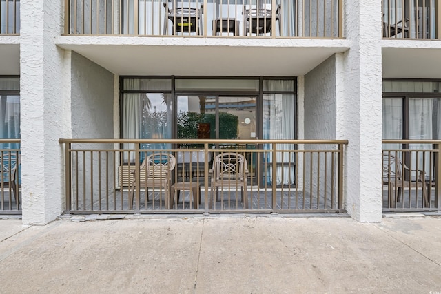 7200 N Ocean Blvd Unit 138, Myrtle Beach, SC 29572 - doorway to property featuring a balcony and stucco siding