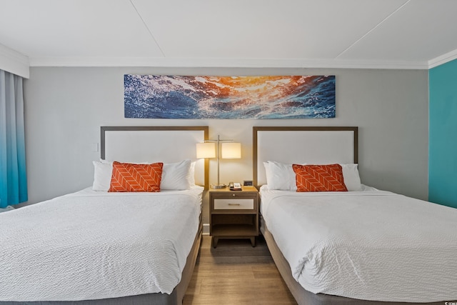 7200 N Ocean Blvd Unit 138, Myrtle Beach, SC 29572 - bedroom featuring ornamental molding and wood finished floors