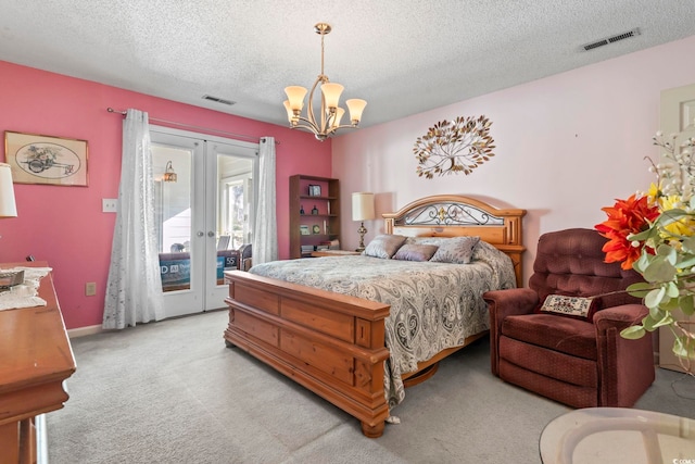 bedroom featuring access to exterior, french doors, light colored carpet, visible vents, and a chandelier