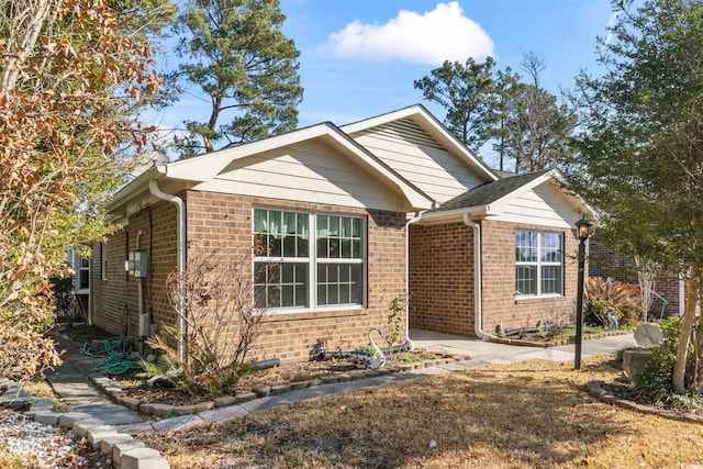 view of front of home featuring brick siding