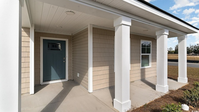 doorway to property featuring covered porch