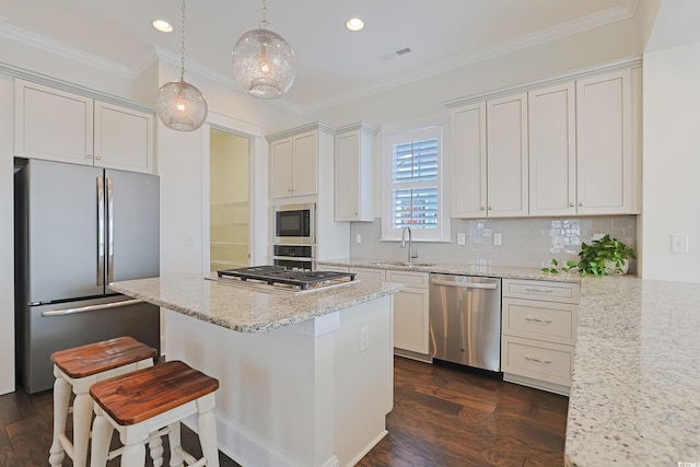 kitchen featuring light stone counters, dark wood-style flooring, crown molding, stainless steel appliances, and visible vents