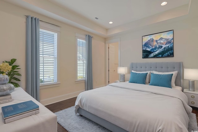 bedroom with dark wood-style flooring, recessed lighting, visible vents, and baseboards