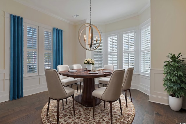 822 Farrow Pkwy, Myrtle Beach, SC 29577 - dining area with a decorative wall, a chandelier, dark wood-type flooring, ornamental molding, and a wainscoted wall