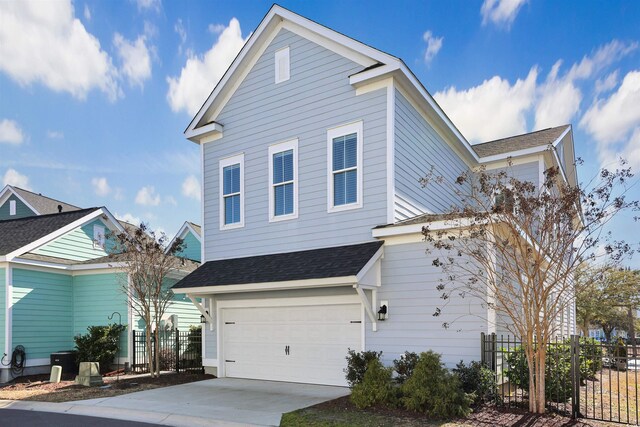 822 Farrow Pkwy, Myrtle Beach, SC 29577 - view of property exterior featuring a garage, driveway, and a shingled roof