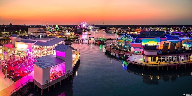 aerial view at dusk with a water view