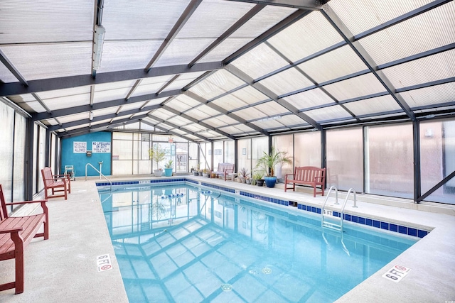 view of swimming pool with a lanai