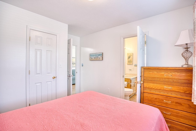 bedroom with connected bathroom