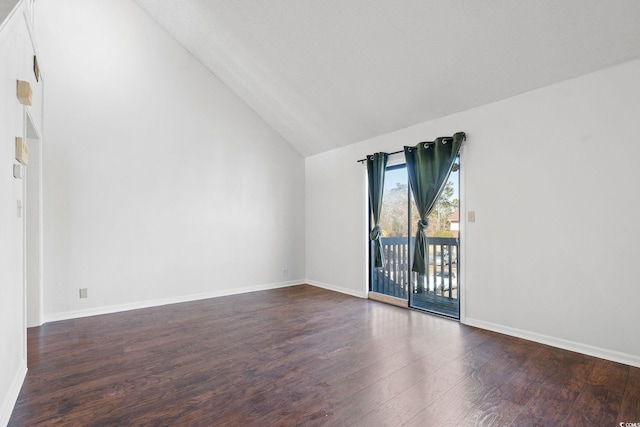 empty room with lofted ceiling and dark hardwood / wood-style floors