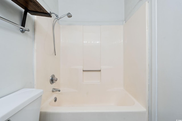 bathroom featuring toilet and washtub / shower combination